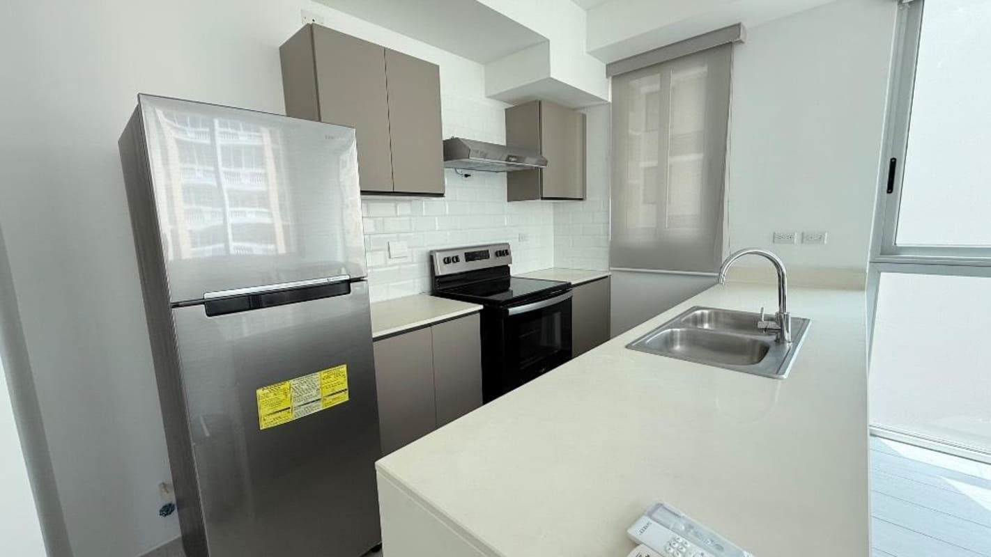 Minimalist bedroom with large window, AC, and city skyline view in PH Urbana Obarrio