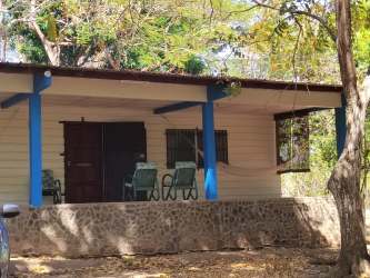 Covered porch with hammock rustic beach house Playa Corona Panama large lot