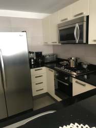 Fully equipped modern kitchen with granite tops and appliances in PH Mosaic Panama Pacifico