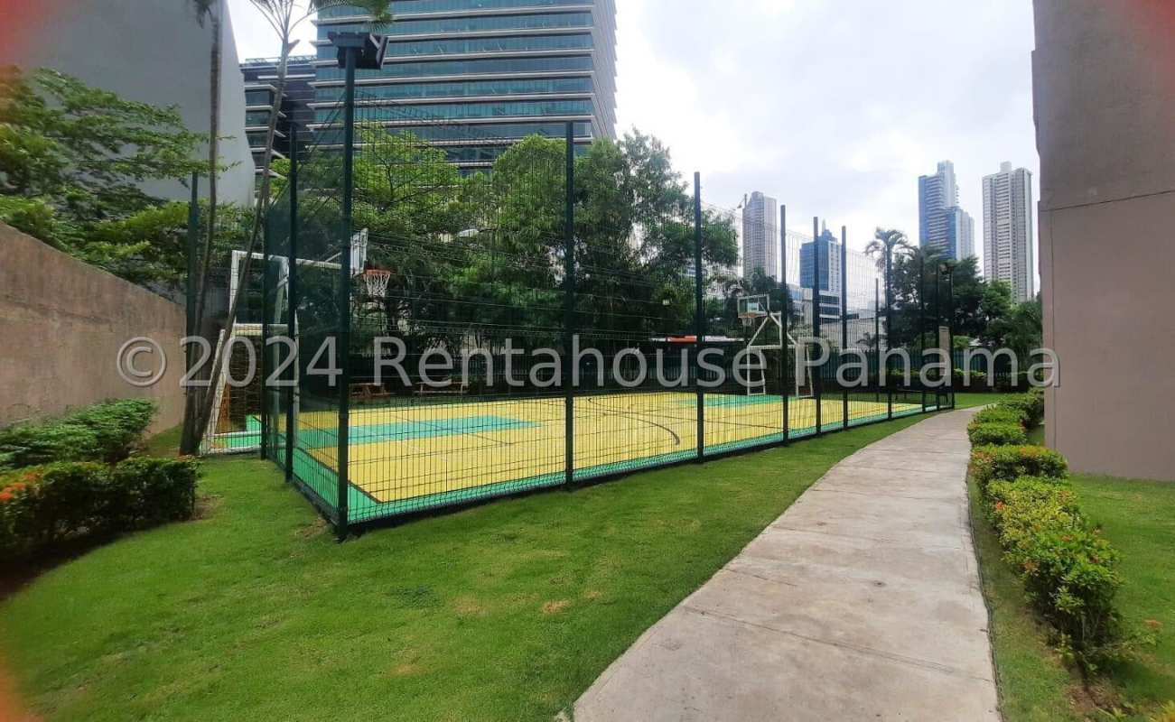 Spacious kitchen with granite countertops and wooden cabinets in Costa del Este apartment