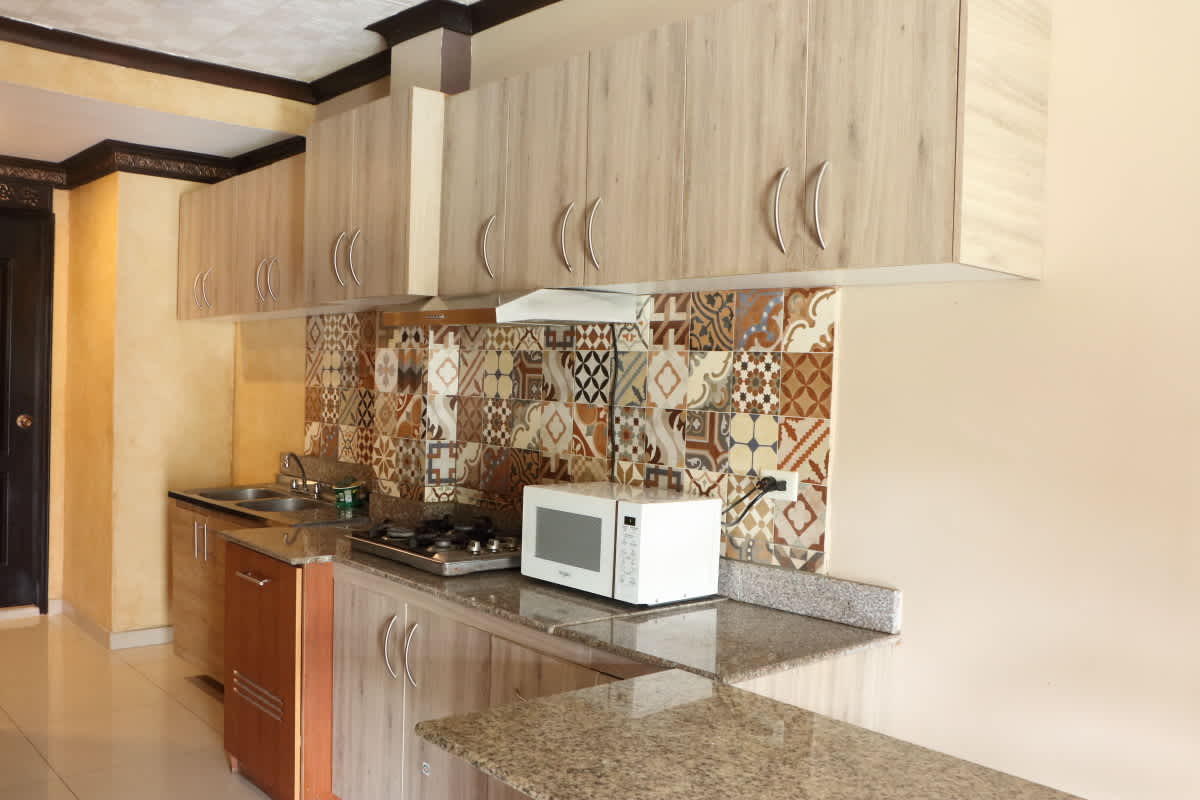 Minimalist bedroom with neutral tones in Bethania for room rental Hola Realty Panama City