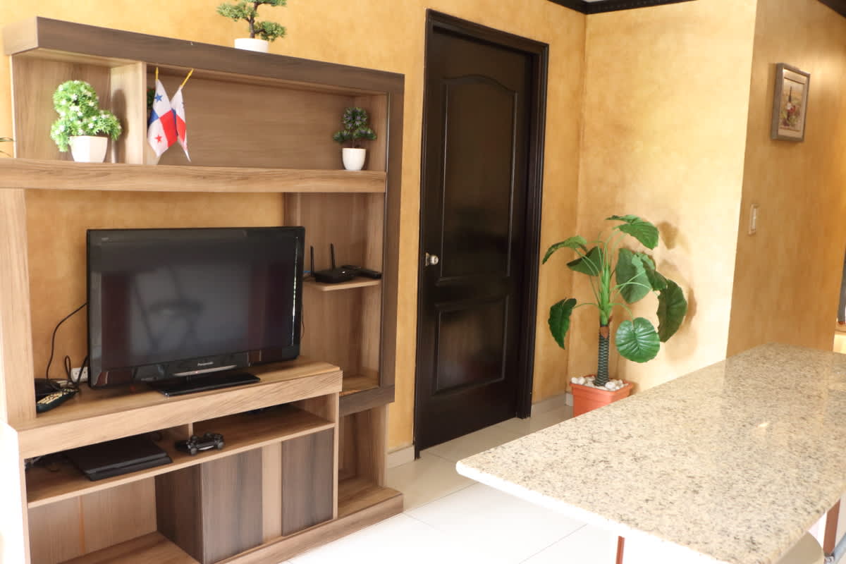 Shared lounge in Bethania room rental with TV entertainment center granite counter and WiFi Hola Realty Panama