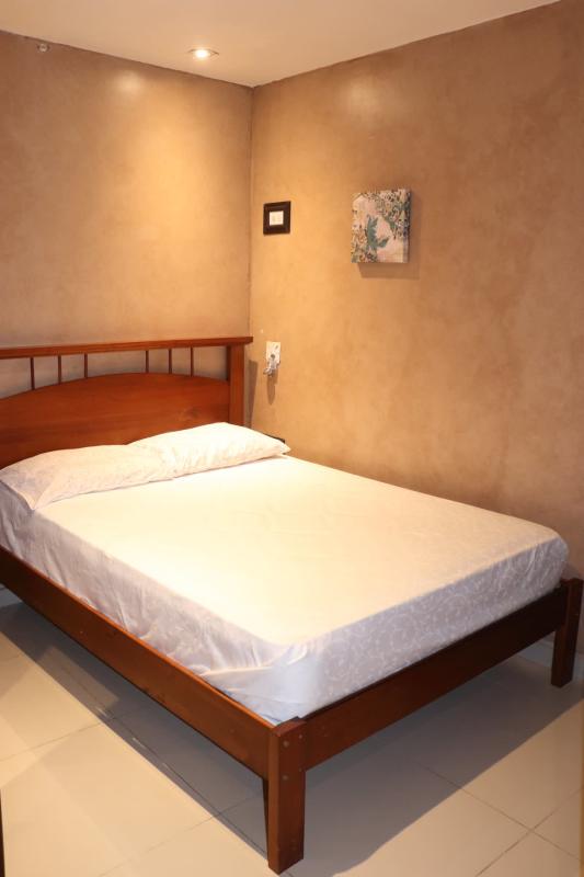 Hallway entry with wall-mounted AC cream wallpaper in Bethania Panama City Hola Realty