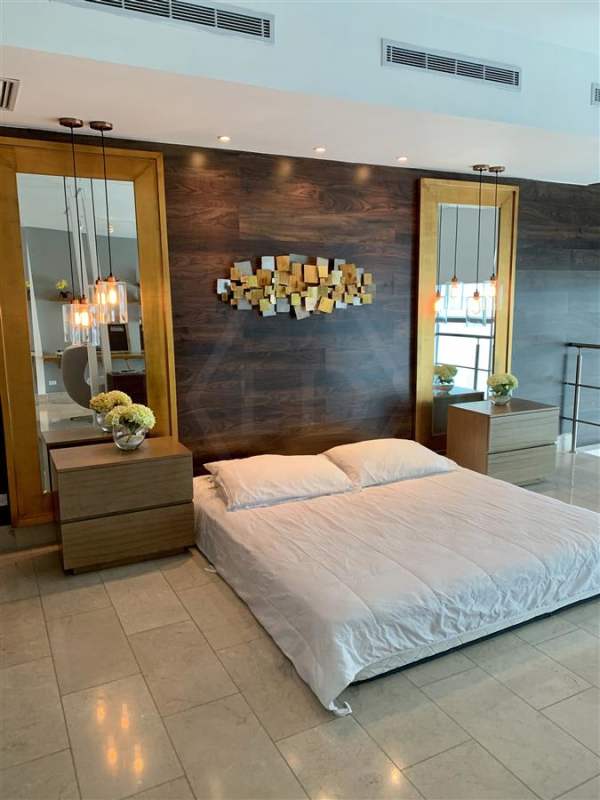 Modern bathroom with double sinks glass shower luxury condo Grand Tower