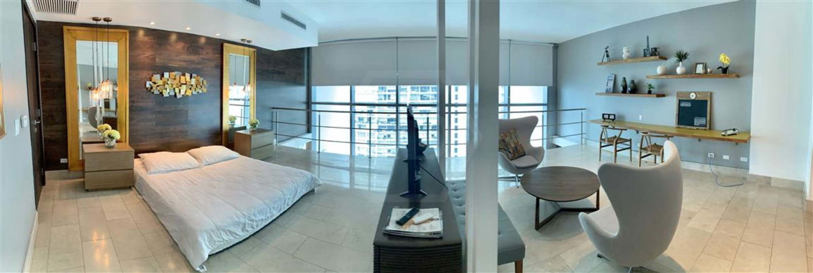 Open loft bedroom with lounge area luxury condo Grand Tower Punta Pacifica