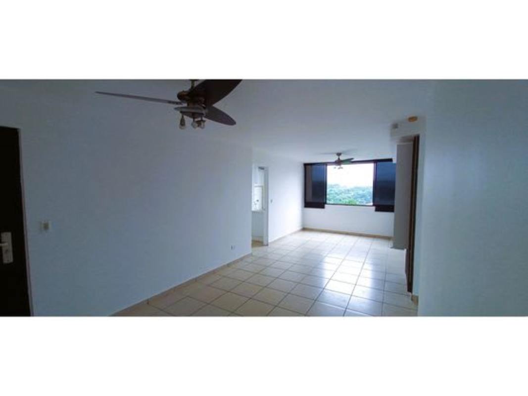 Bright living area with large windows and ceiling fans at PH La Locería Betania Panama City