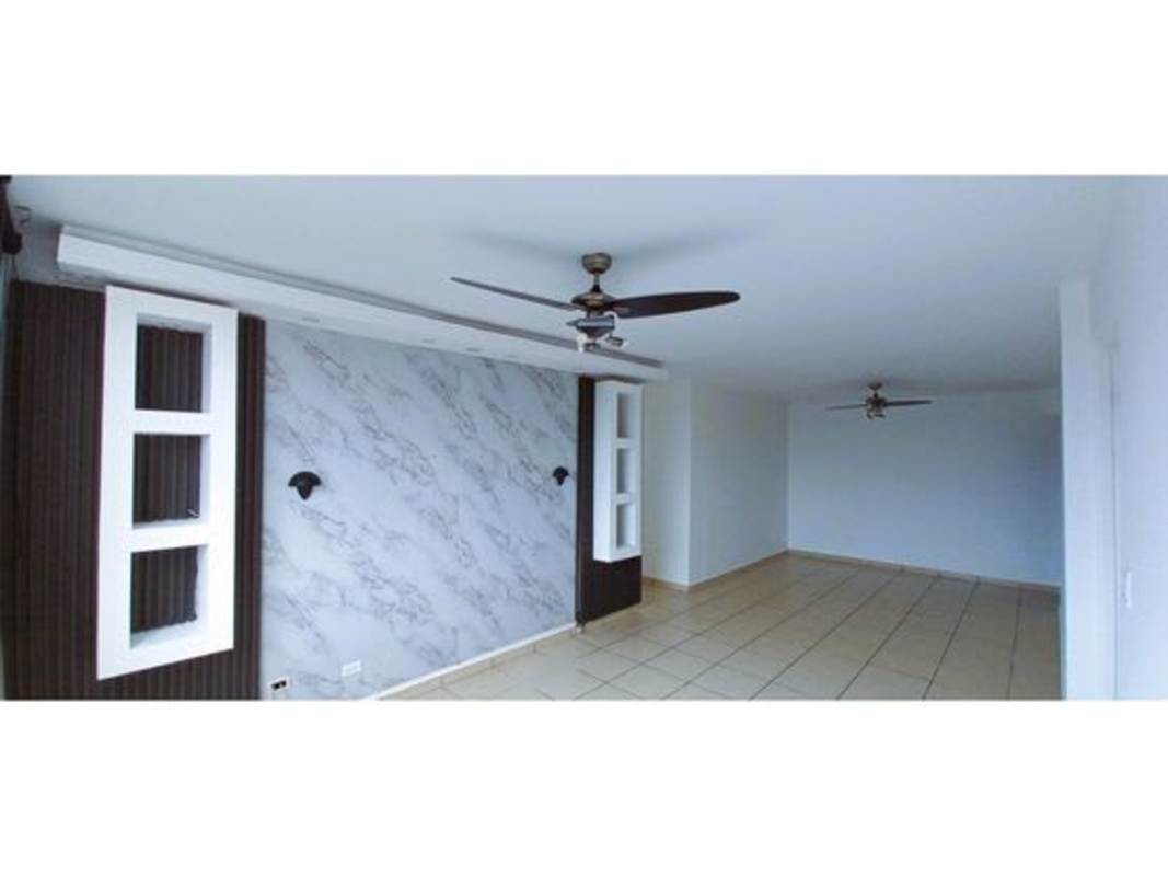 Large open living room with marble accent wall ceiling fans PH La Locería Betania Panama