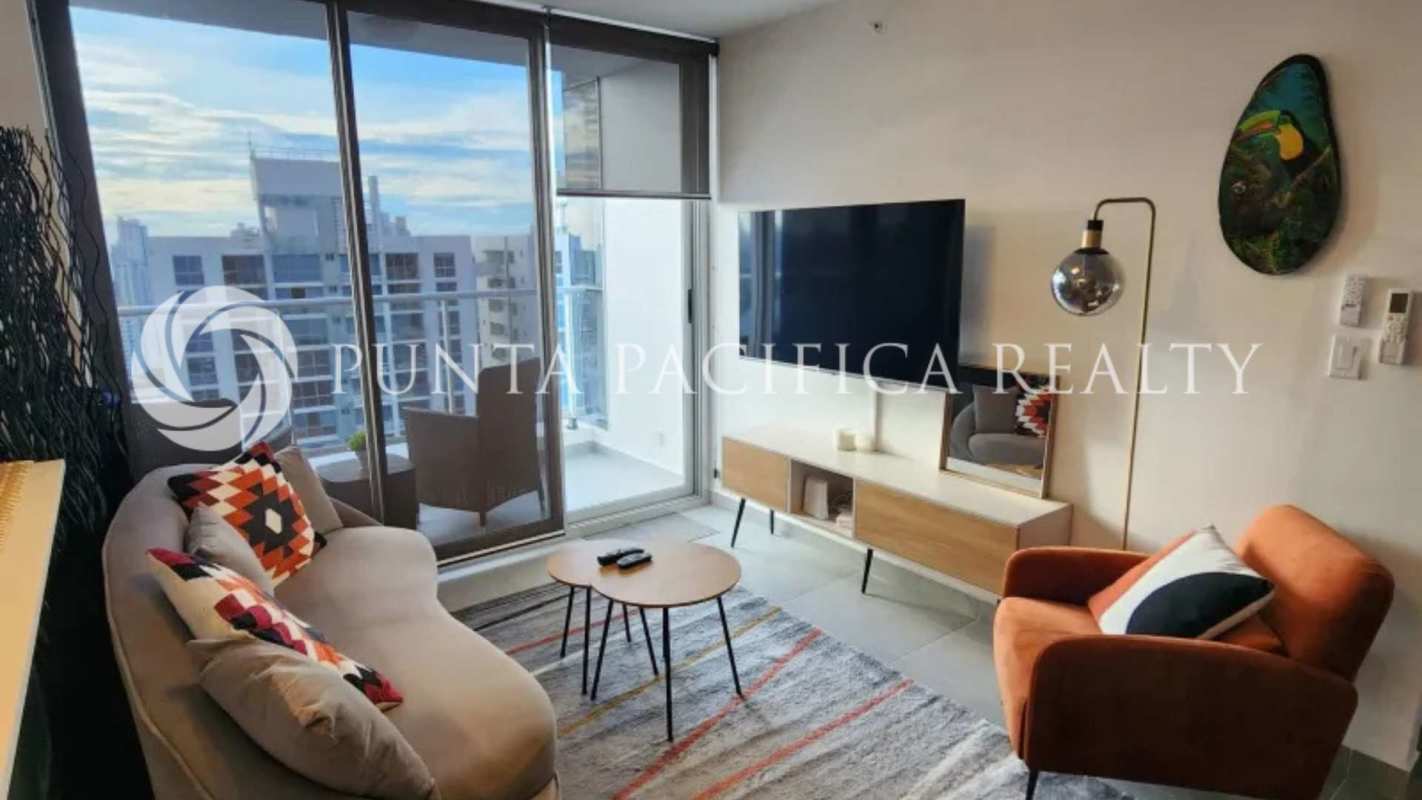Modern open living room with balcony access and skyline views in PH Park Square Panama City