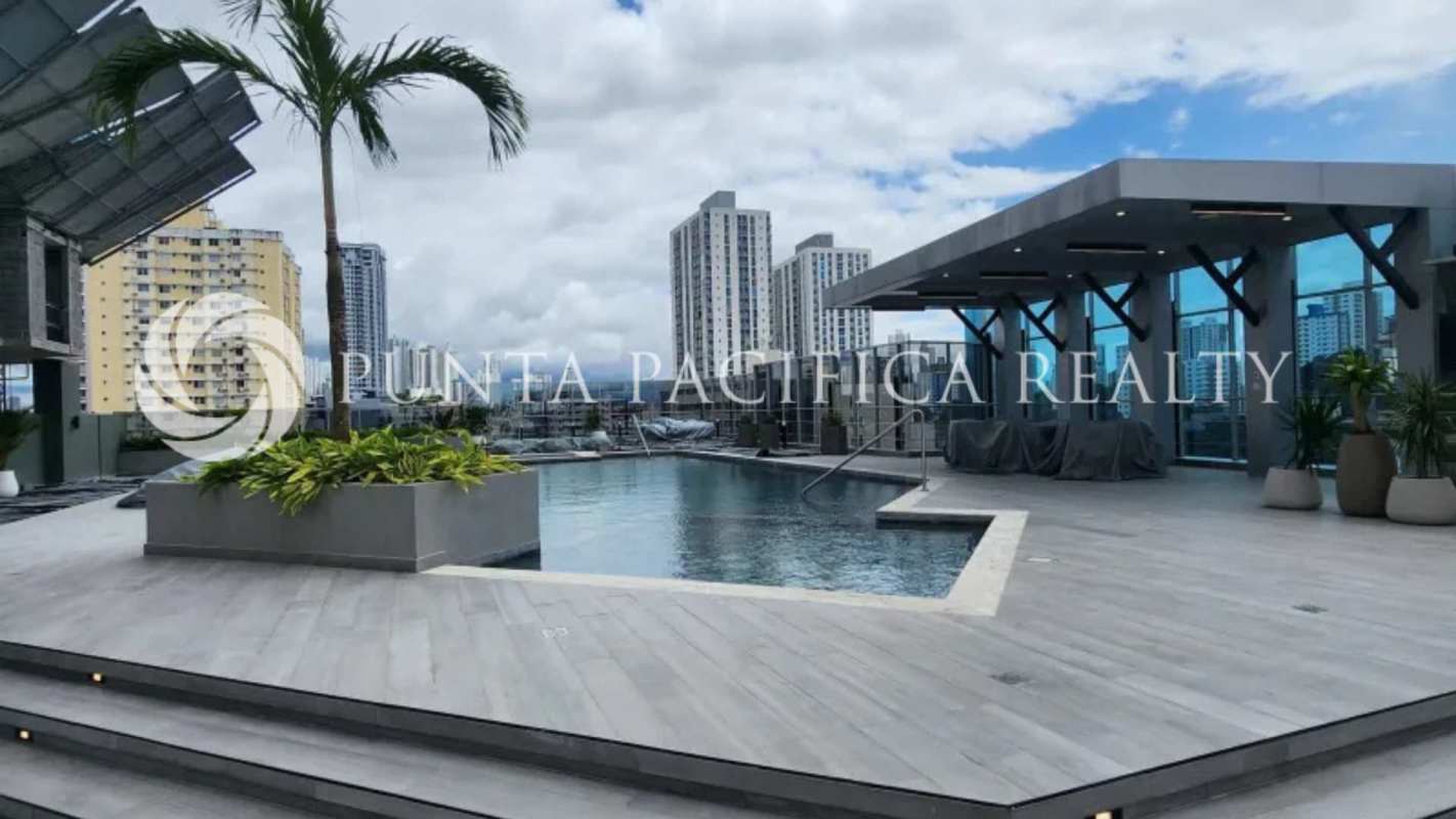 Rooftop swimming pool with panoramic city skyline views at PH Park Square Panama