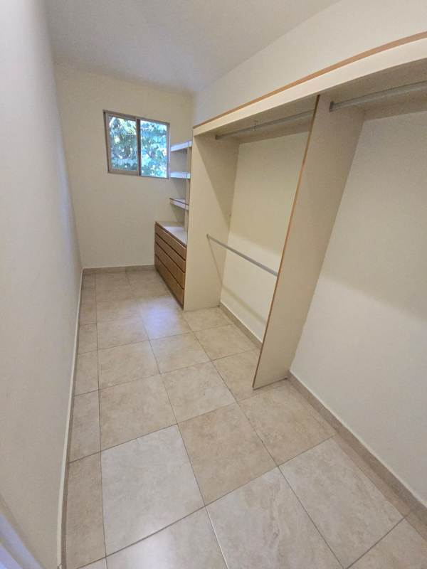 Large kitchen with wood cabinets, granite counters, and appliances Embassy Gardens Clayton Panama