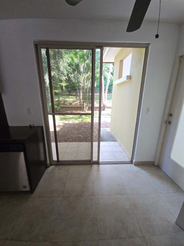 Guest bathroom with marble countertop vanity and tiled shower Embassy Gardens house Panama