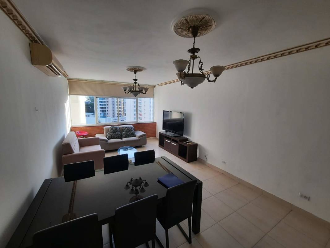 Contemporary bathroom with beige tiles, glass shower, Edison Park Panama apartment