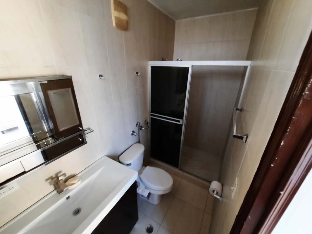 Bathroom featuring glass shower enclosure, sink vanity in PH Edison Park apartment Panama