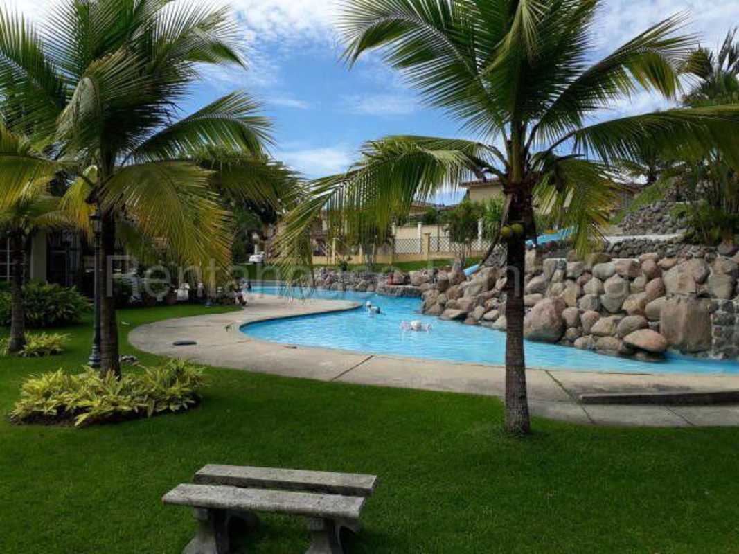 Playground area with slides swings grass lawn Dorado Spring Condado del Rey Panama