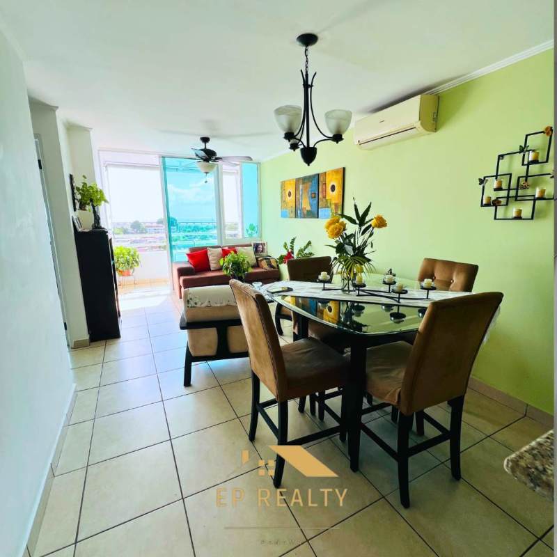Open-concept living dining room with large windows and AC unit PH Parque Lefevre Residence near Via España Panama City