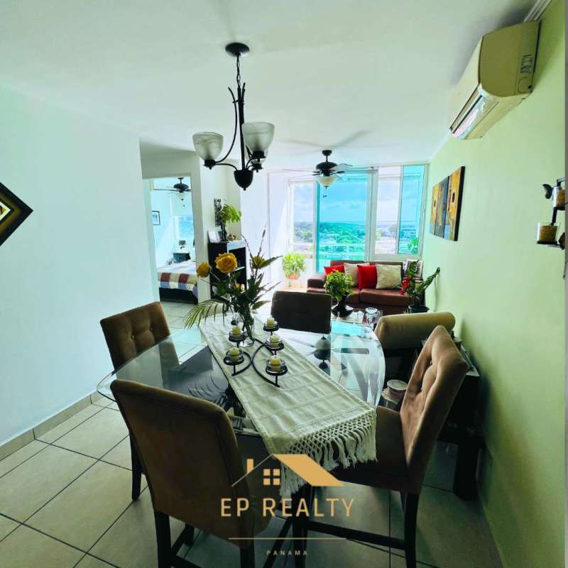 Modern kitchen with granite countertops, wood cabinets at PH Parque Lefevre Panama