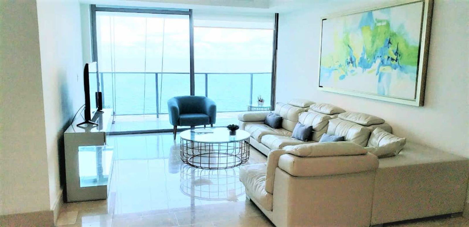 Master bedroom with floor-to-ceiling windows and private balcony ocean view in PH Grand Tower Panama City