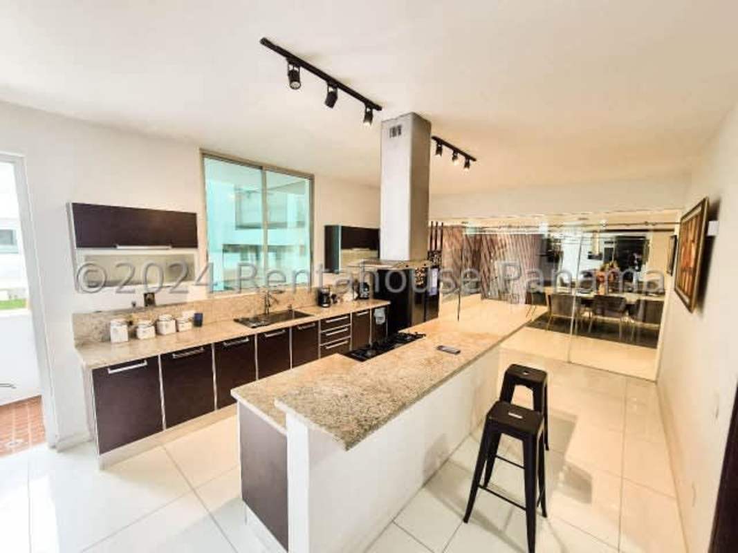 Spacious covered patio terrace overlooking private pool and landscaped garden luxury rental home Panama