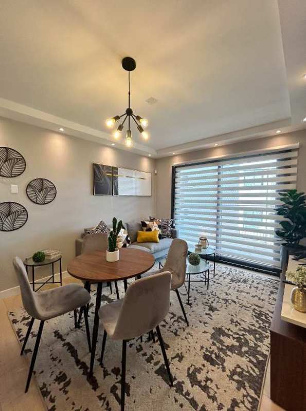 Spacious living dining area with large windows in Las Mañanitas apartment Panama