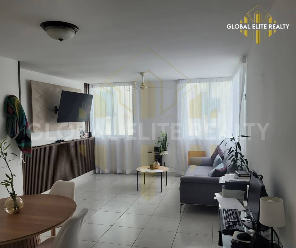 Bright living dining area with ceramic tile floor and city view Betania apartment Panama