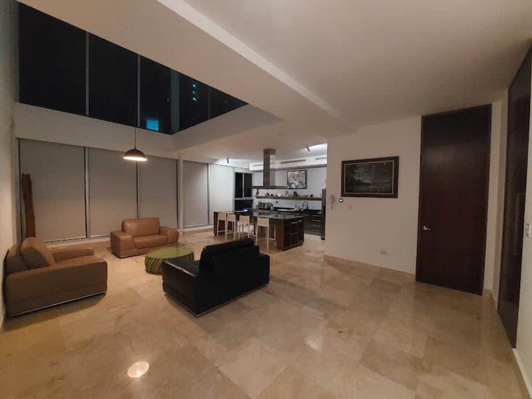 Spacious loft bedroom with ocean views, glass walls and walk-in closet at PH Loft 41 Punta Pacifica Panama