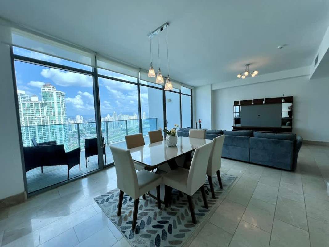 Modern closed kitchen with granite countertops, oven, gas stove, stainless appliances Punta Pacifica apartment