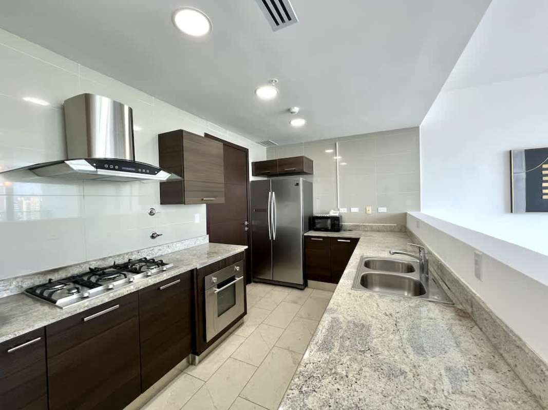 Master bedroom suite with large window Pacific Ocean views PH Grand Tower Panama