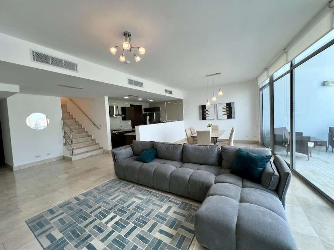 Spacious living room with floor-to-ceiling windows and ocean views at PH Grand Tower Punta Pacifica