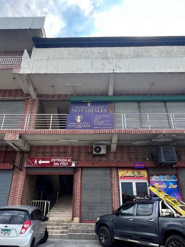 Empty partitioned room with tiled flooring and white walls inside Plaza Feliz San Miguelito Panama