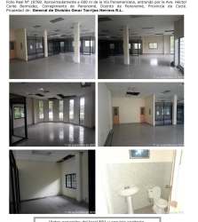 Interior office space with tile flooring, glass partitions, windows, and restroom in Penonomé Coclé commercial building