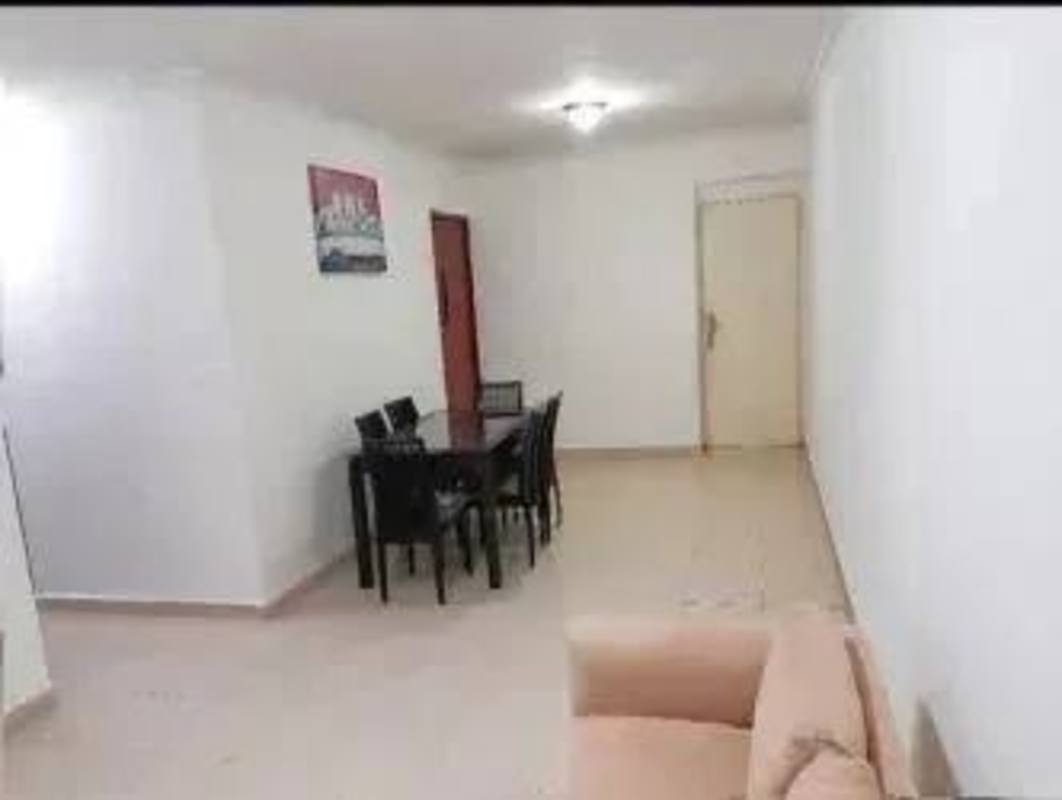 Open living and dining space with balcony, tiled floors, and natural light in Condado del Rey Panama apartment