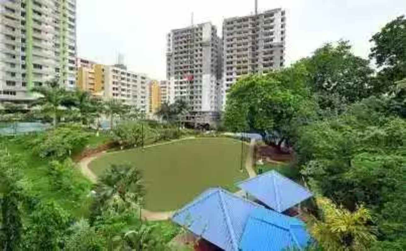 Covered children's playground with swings, slides in Condado del Rey apartment complex