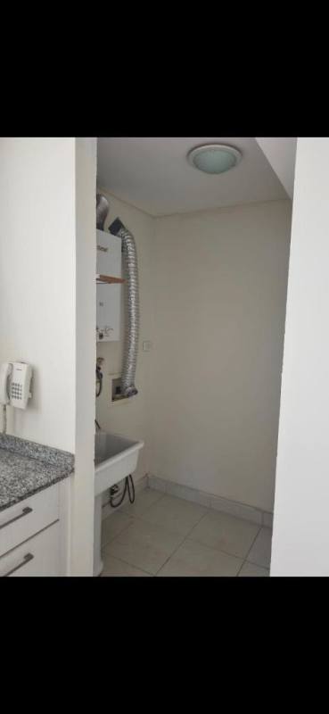 Compact laundry space with sink and water heater in PH Torres de Cantabria Las Acacias Panama City