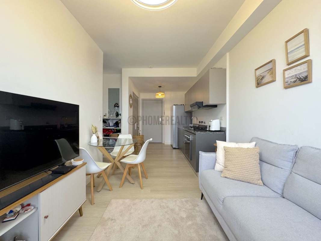Open kitchen space with granite countertops and cabinetry in PH San Francisco Bay Panama