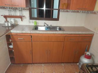 Traditional kitchen double sink tiled countertops wooden cabinets Nueva Gorgona Panama house