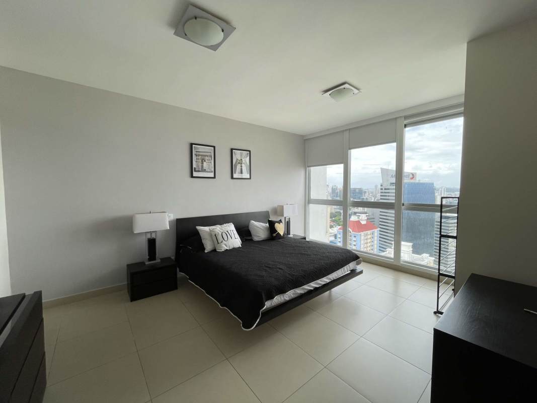 Minimalist bedroom floor-to-ceiling windows city skyline PH Oceanaire Punta Pacifica Panama