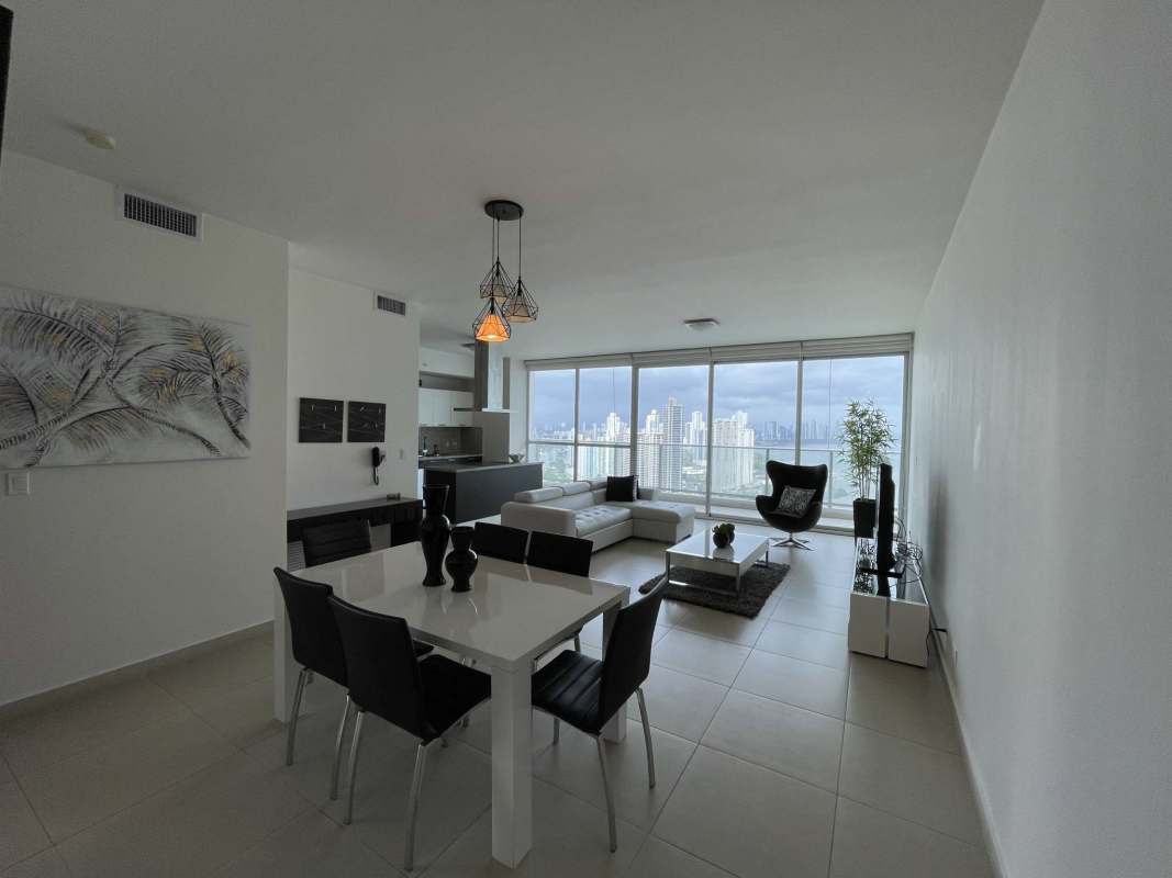 Open luxury condo living dining area floor-to-ceiling windows city skyline Punta Pacifica Panama