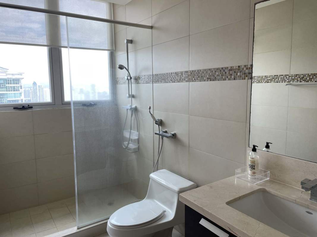 Bright bathroom with walk-in shower large window city view in PH Oceanaire Punta Pacifica Panama