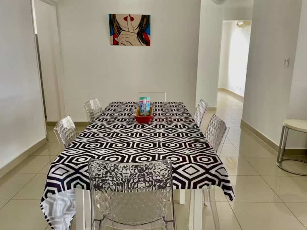 Modern kitchen with wooden cabinets, granite countertops, and full appliances San Francisco Bay Panama