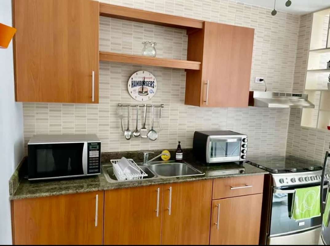 Modern living room with panoramic windows showing Pacific Ocean in PH San Francisco Bay Panama