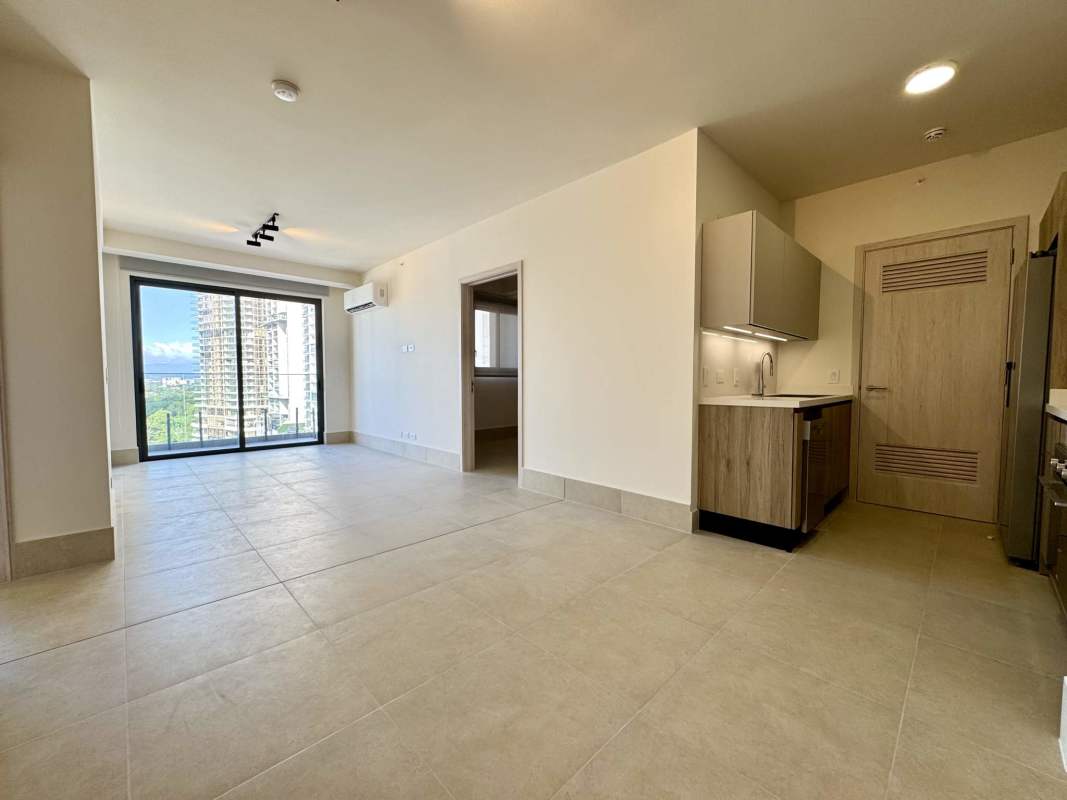 Bright bedroom with large windows, tile floors, built-in closet and city view at PH Ocean House