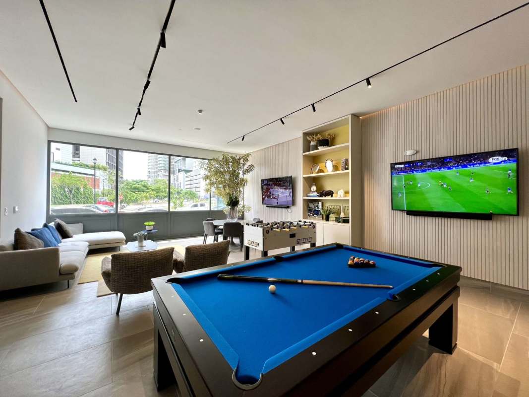 Modern gym with bikes, weight equipment, and panoramic views PH Ocean House Santa Maria