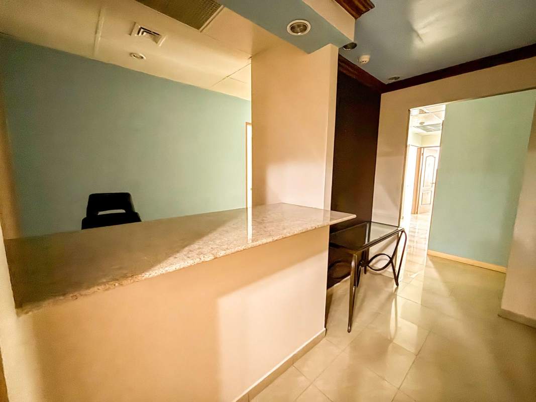 Reception desk granite countertop glass table in lobby of City Center Tower Panama