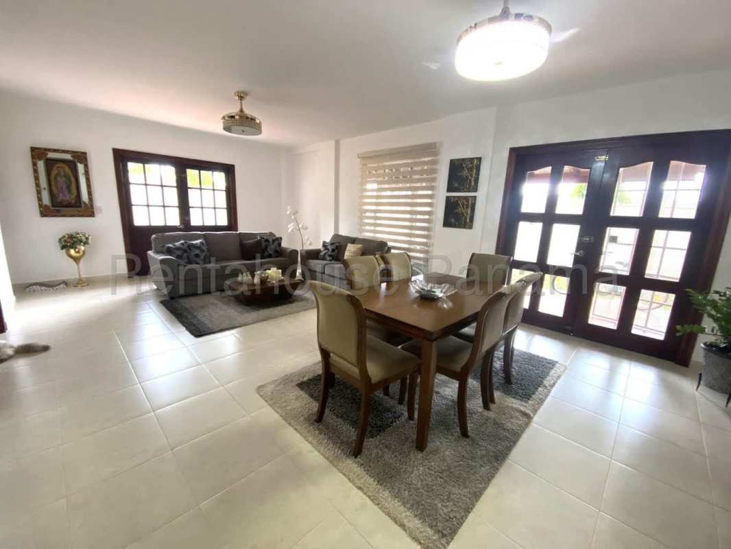 Kitchen with granite countertops, wood cabinets and appliances at Villa Valencia Costa Sur Panama