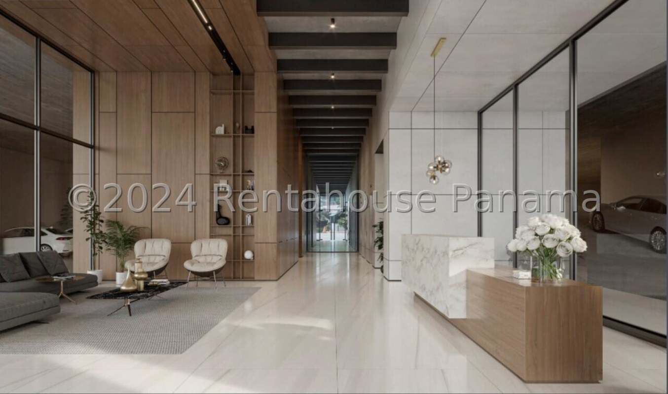 Double-height luxury lobby with marble finishes and concierge at PH Marina Pinnacle Punta Paitilla