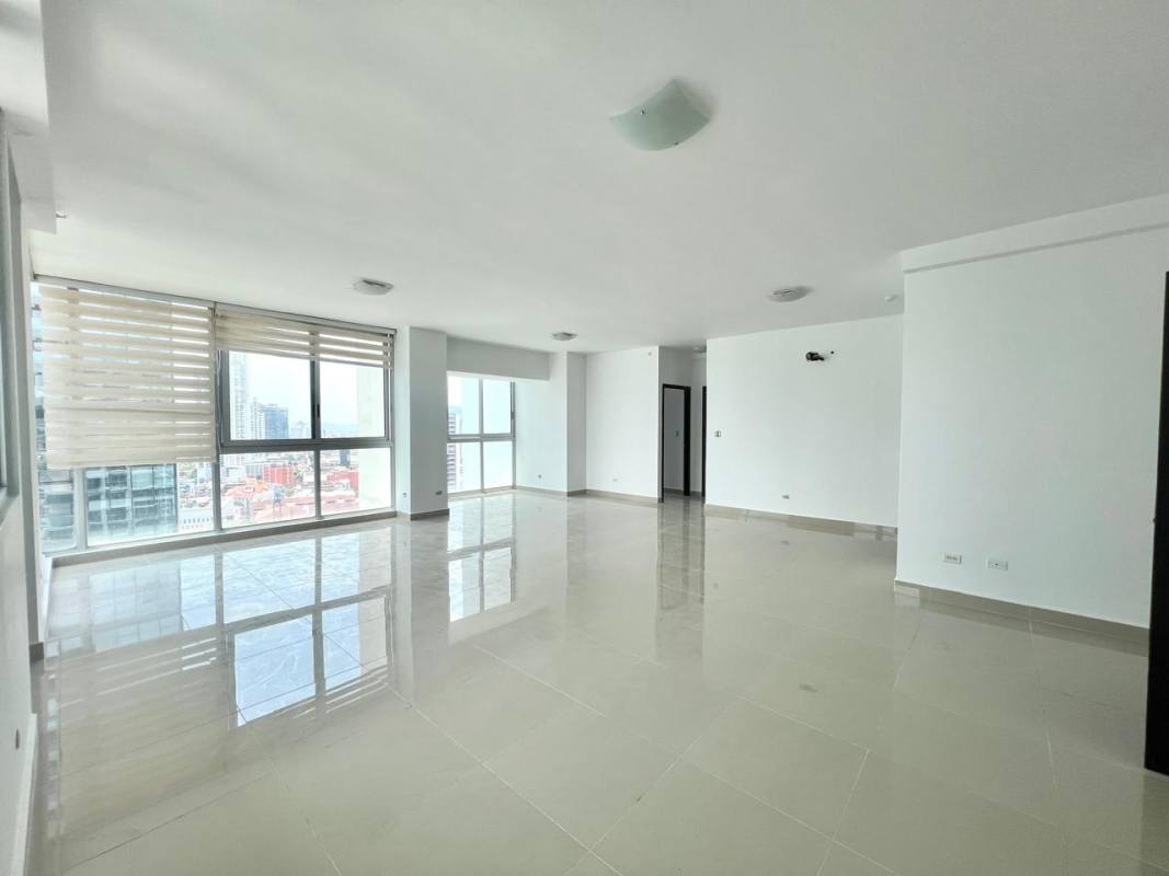 Fully equipped kitchen with granite countertops, dark cabinetry and tiled walls at Belle View Tower Panama