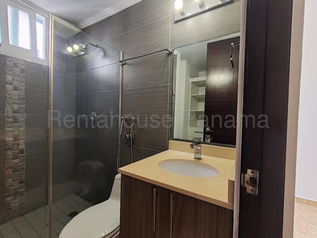 Open kitchen with granite countertops and gas stove in Cosmpolitan Tower Panama apartment rental