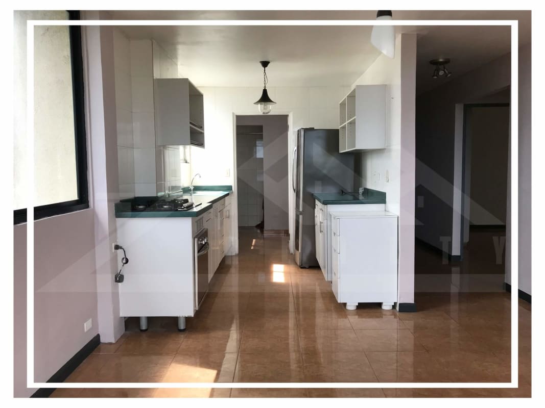 Modern kitchen with cabinets, stove, fridge in Villa de las Fuentes Panama