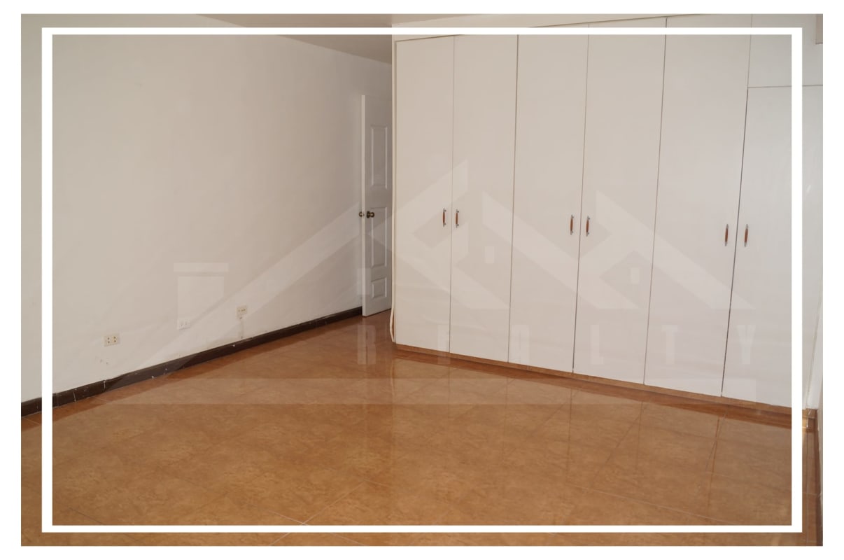 Master bedroom with split AC, closet, large window in Villa de las Fuentes Panama City