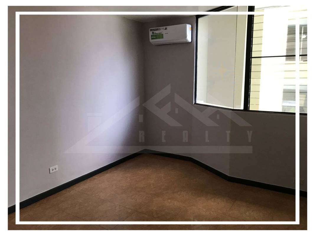Bedroom with split AC, large window natural light in Villa de las Fuentes Panama